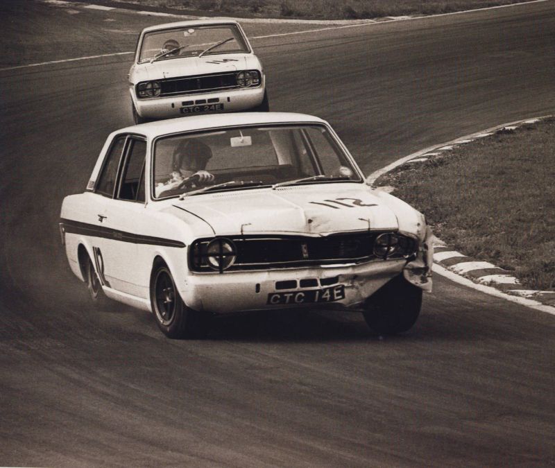 Jackie Ickx leading Graham Hill- photo by Peter Darley